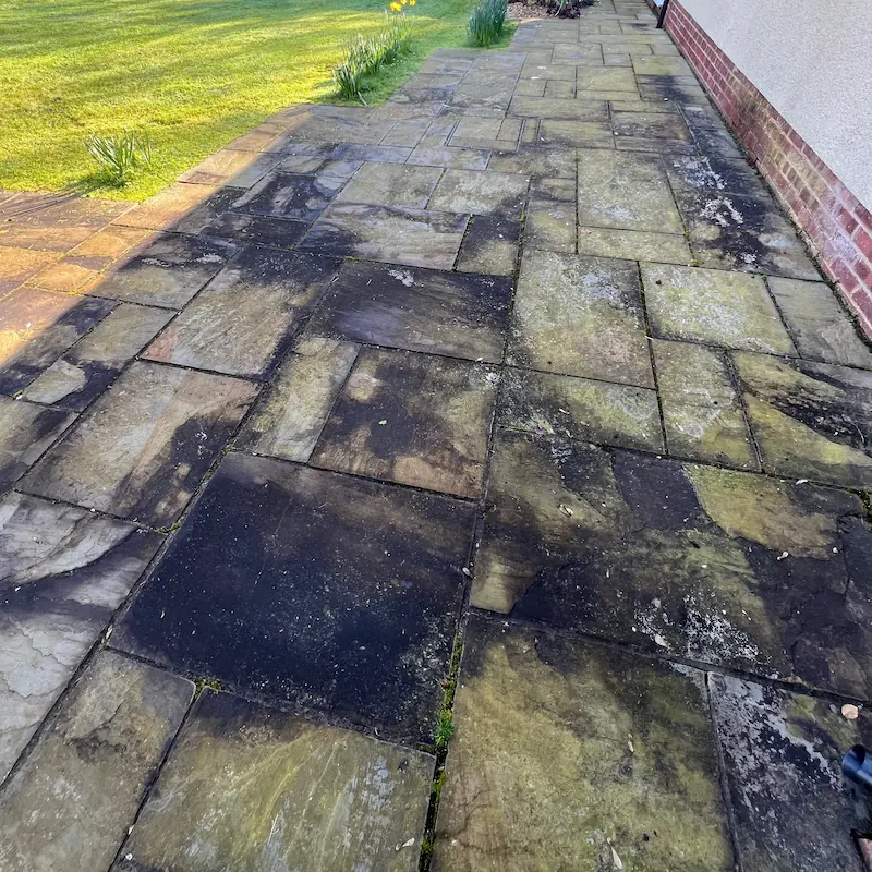 Dirty patio before Puralux wash